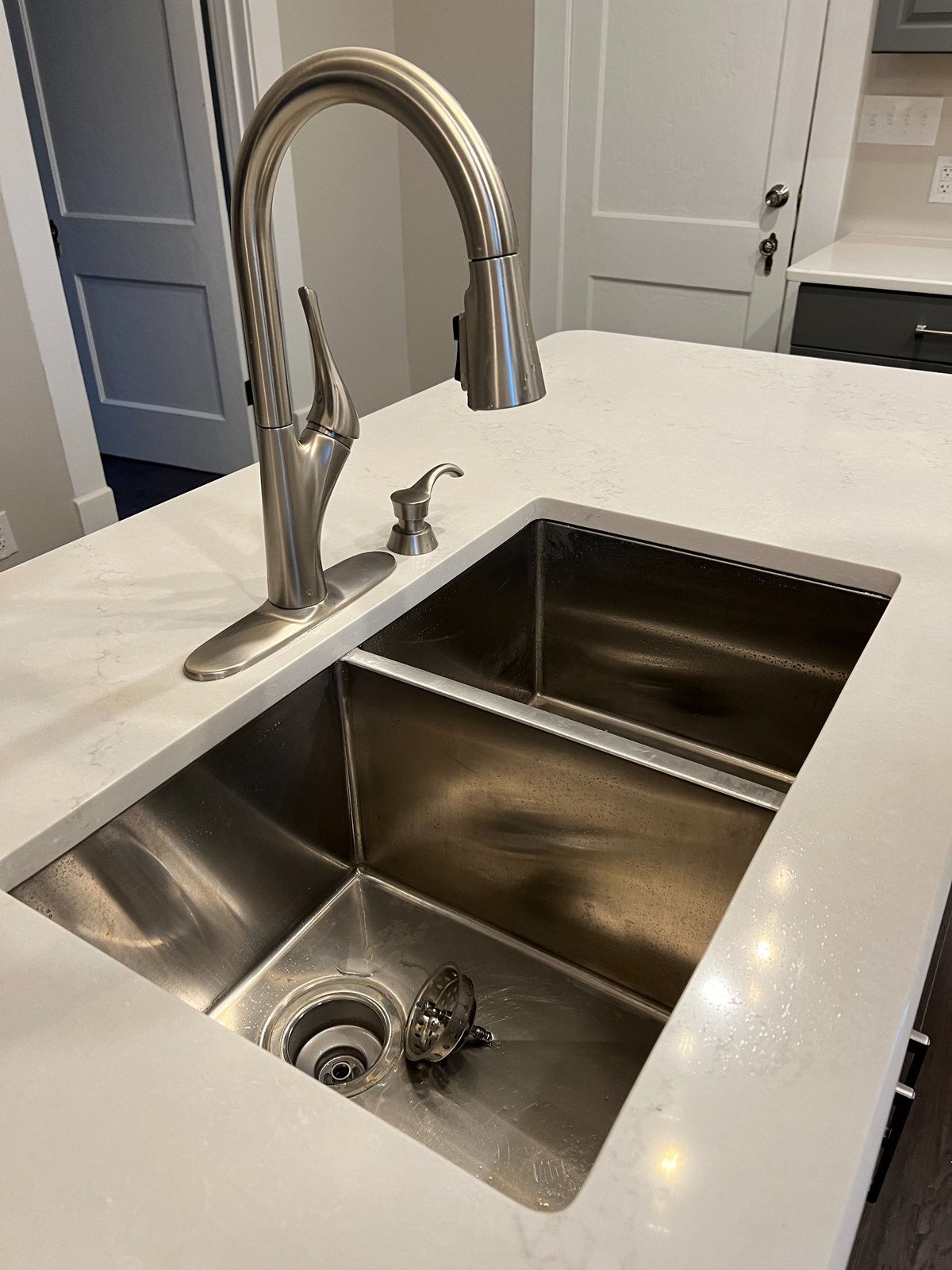 Kitchen faucet and sink detail at 225 Bond Street
